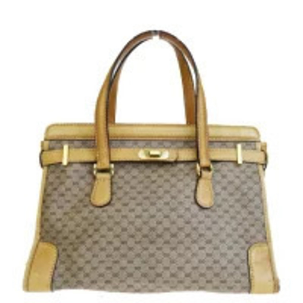 Gucci GG Supreme handbag top handle turnlock closure Brown